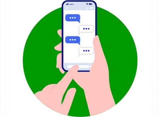 Hands holding phone texting