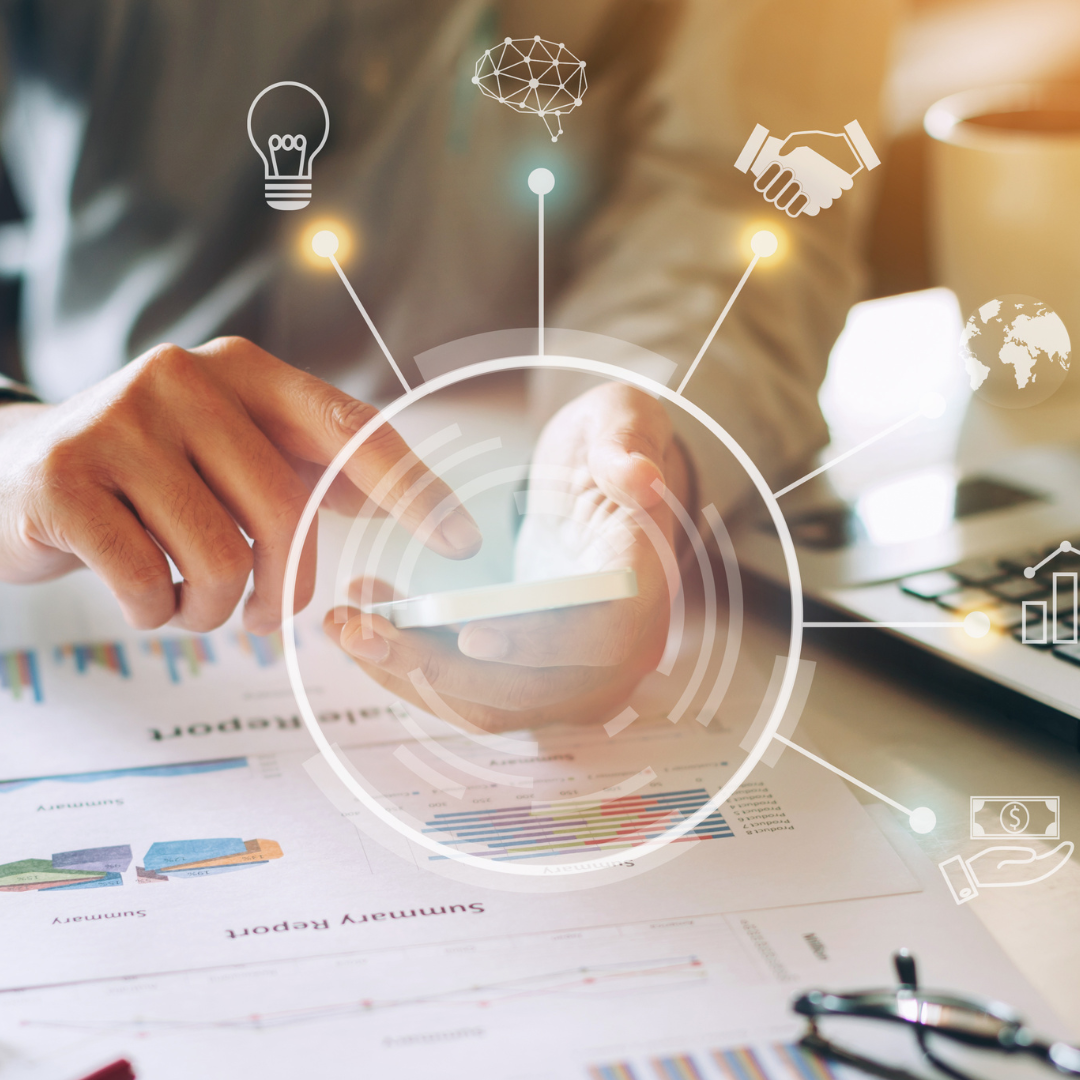 A futuristic rendering of someone looking at a phone, with different components coming out of it