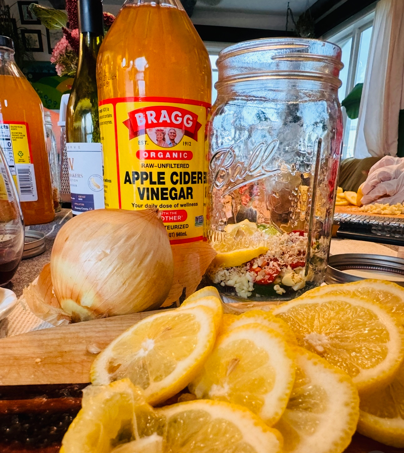 A table full of fire cider ingredients being chopped and prepped. 