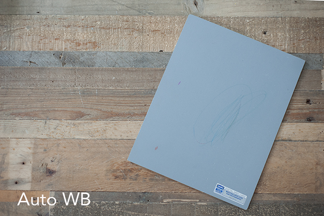 A photo showing how auto white balance does on a gray piece of paper.
