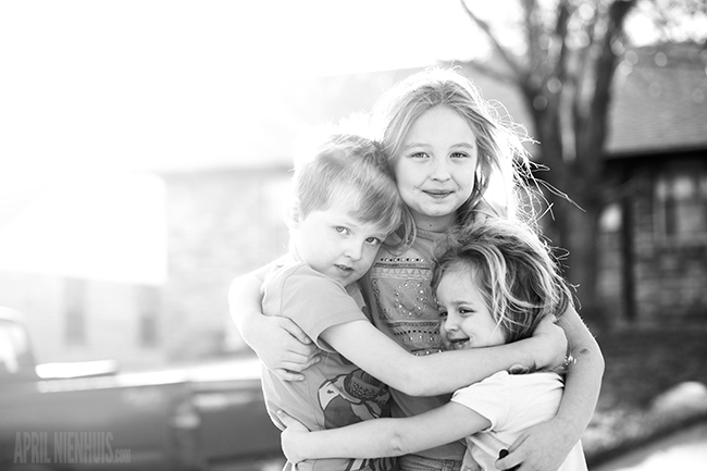 three children hugging sharp photo from f-stop