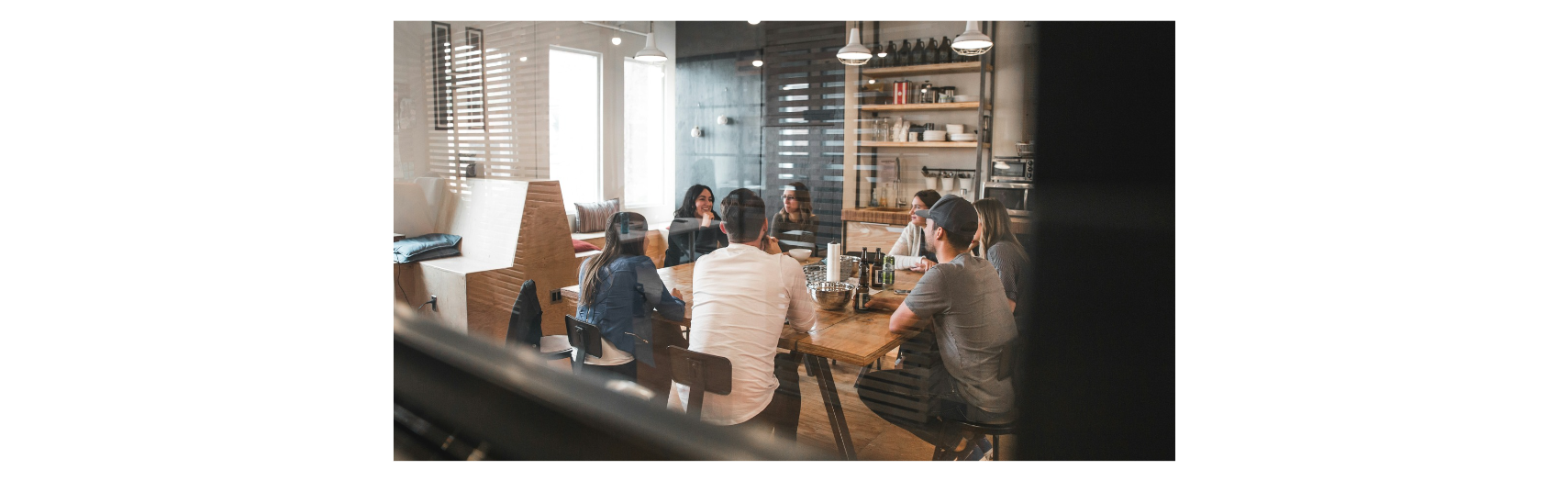 group of people sitting around a table