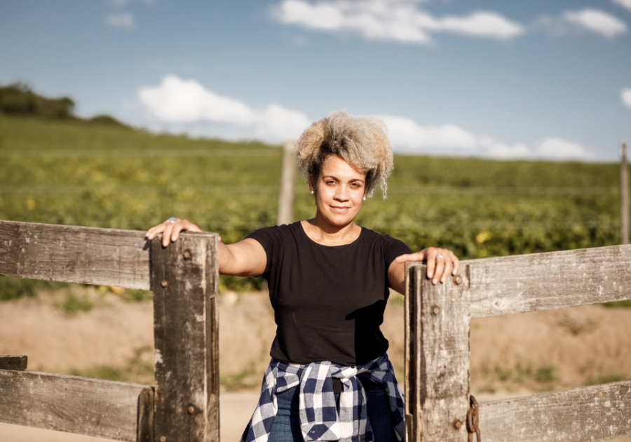 A woman opening a gate