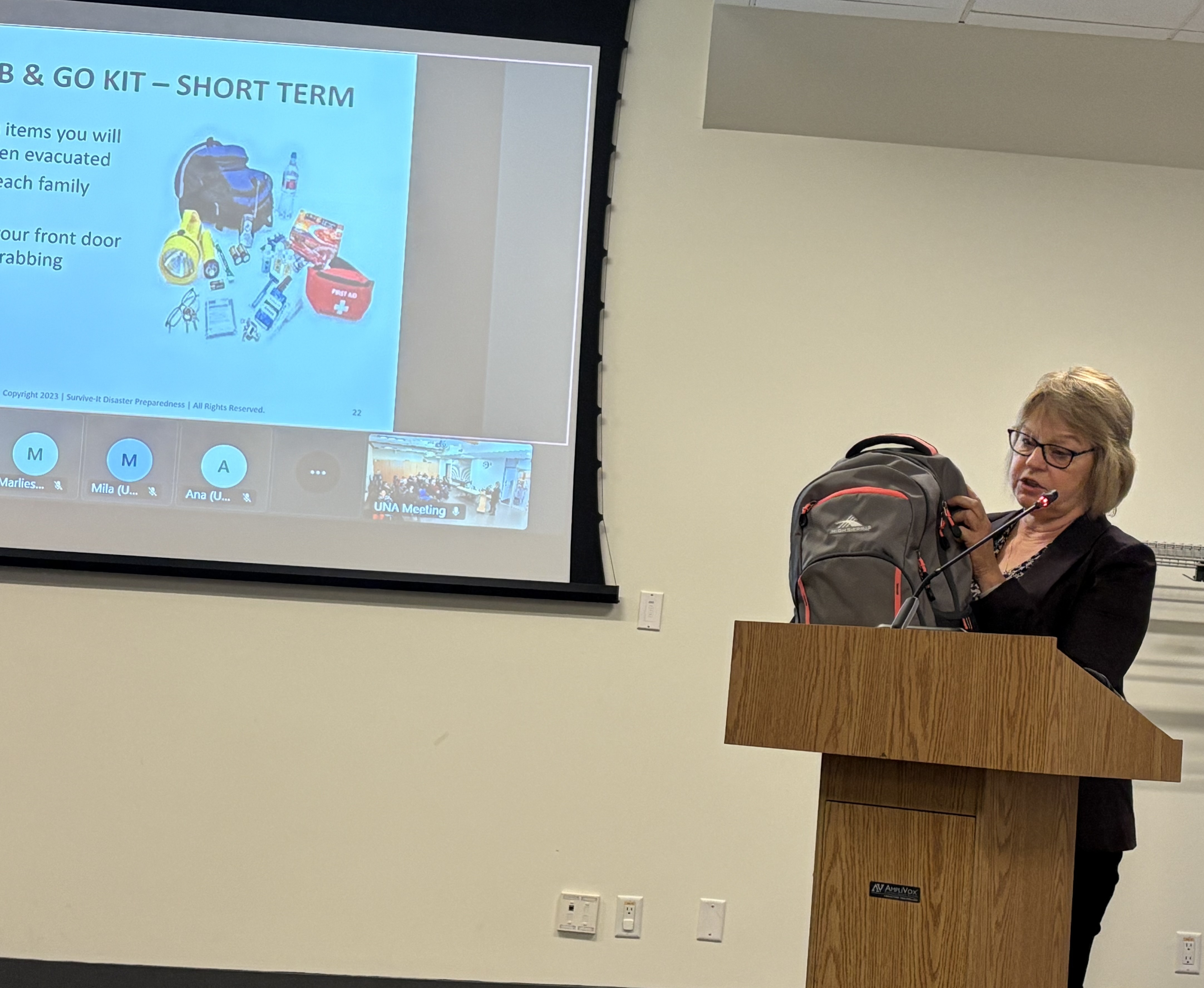 Jackie holding Grab and Kit - presenting