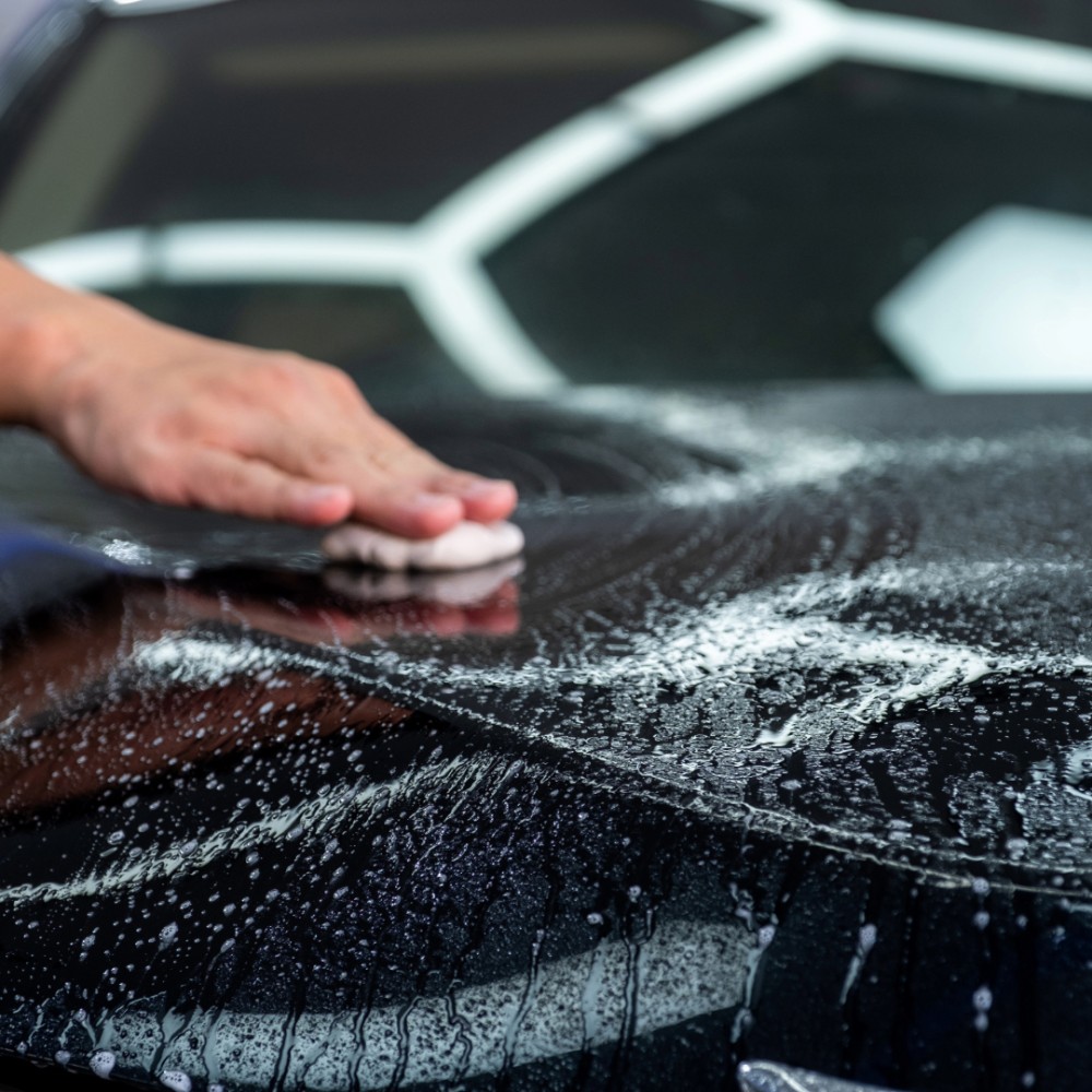 clay bar on a black car