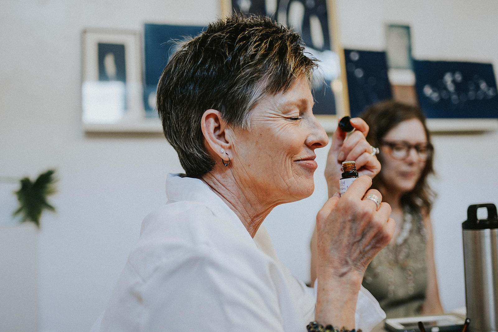 A woman smelling essential oils