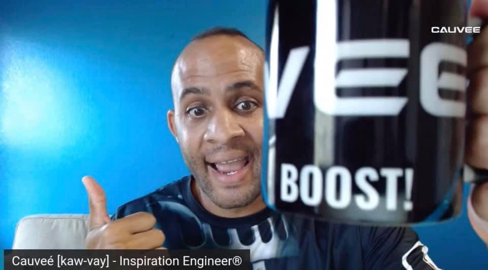 Cauvee sharing a mug that says BOOST on it as if cheering you