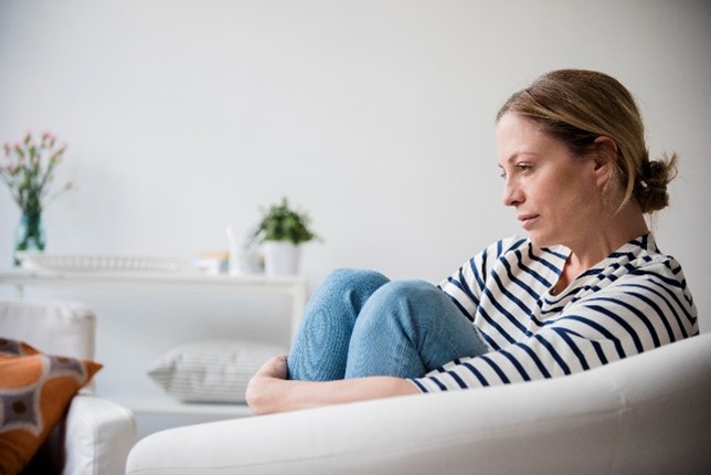 Woman sitting on a chair.
