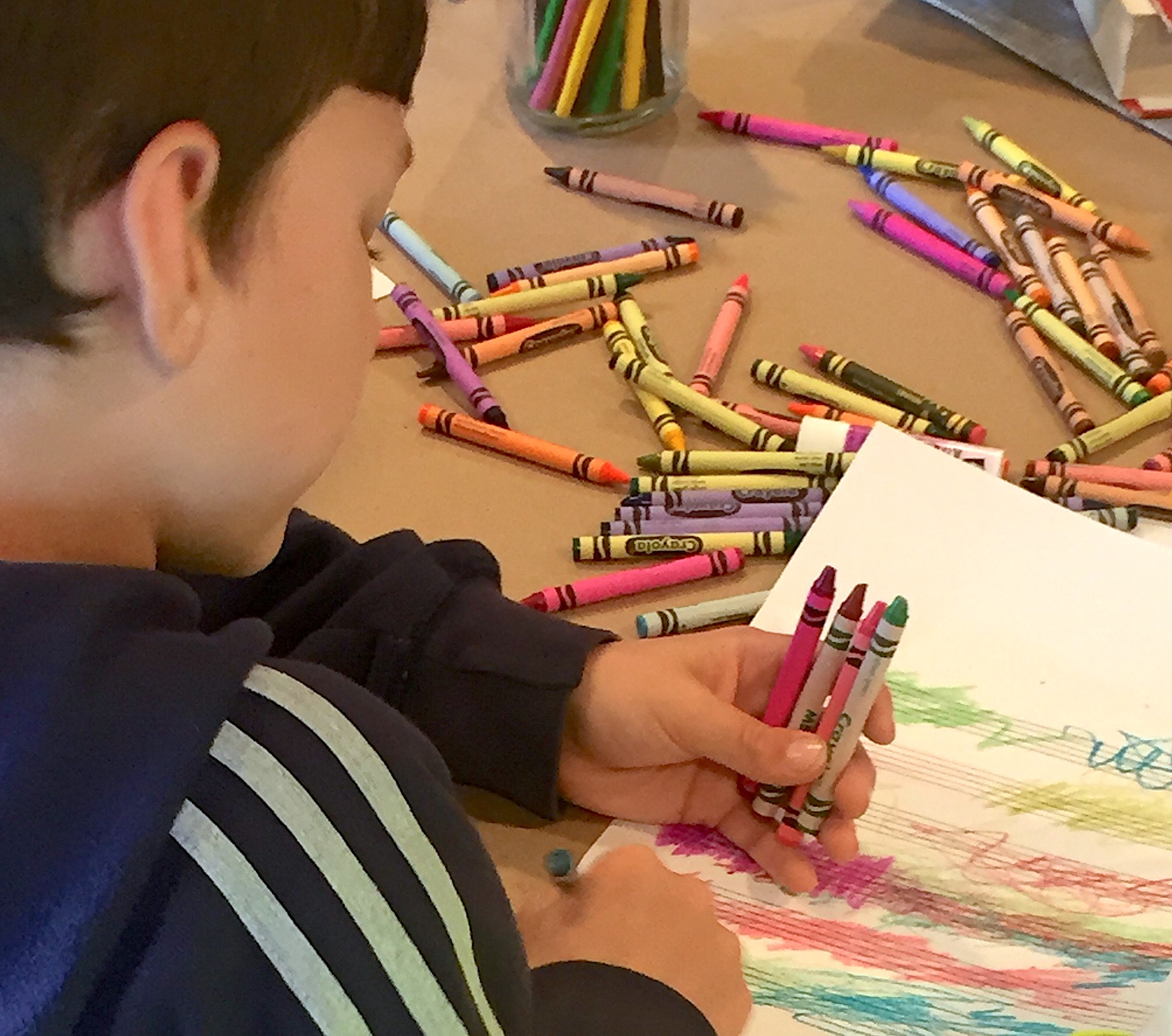 Child composing music in color based on what he hears - a creative reading activity for THE PHANTOM TOLLBOOTH by Norton Juster - from LitWits Workshops