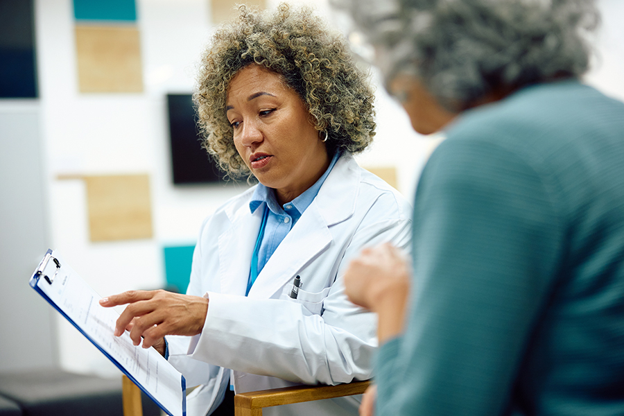 healthcare provider explaining A1C results to patient