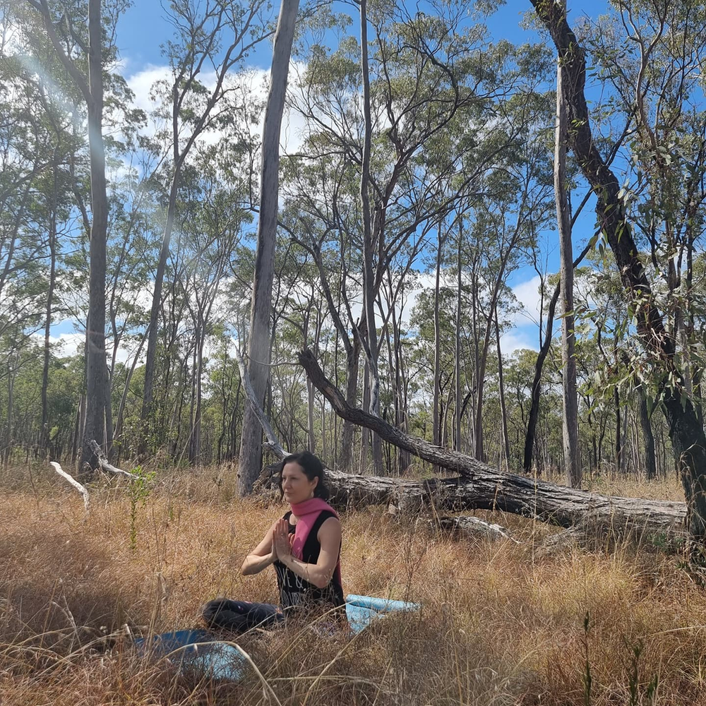 A woman meditating in nature