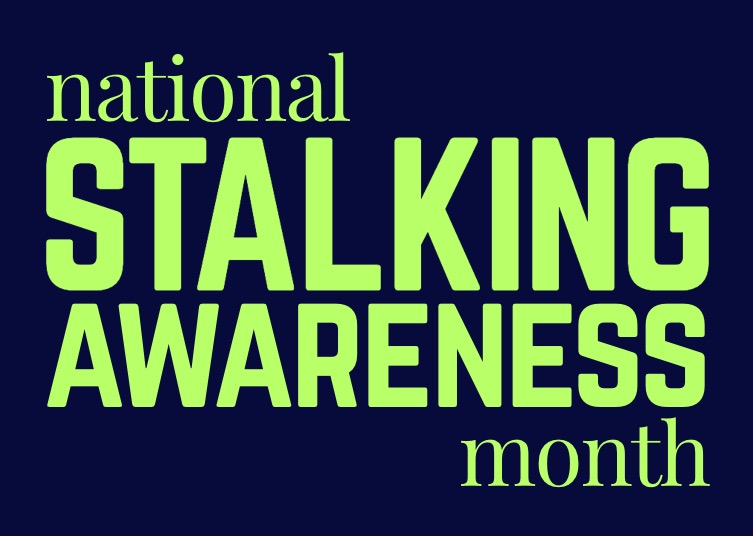 navy blue background with the words national stalking awareness month in lime green