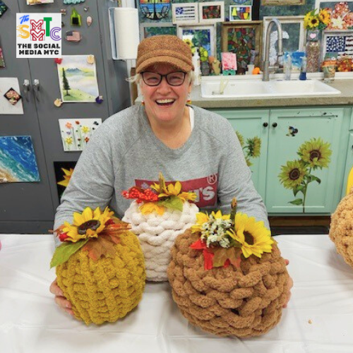 Laura at Chunky Yarn Pumpkin Class with 3 pumpkin creations
