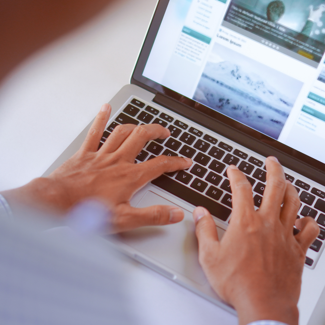 man on a computer writing a blog post