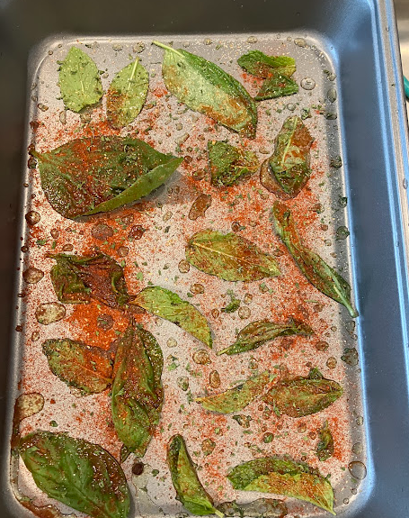 mint olive oil and seasonings in a baking pan