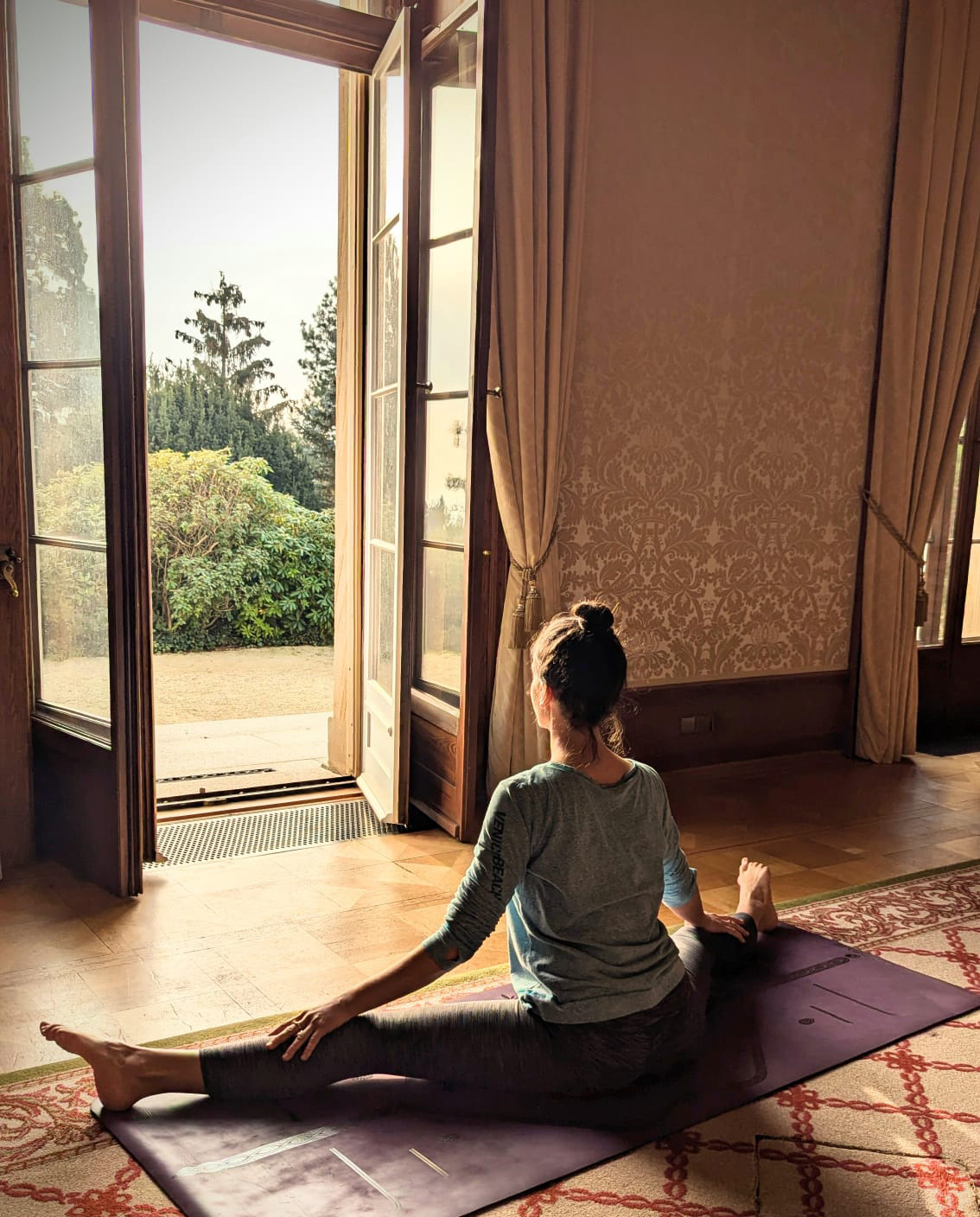 In a sunlit room, Katie sits in quiet reflection—grounded, open, and present. This is where healing begins. After years of internalizing judgment and self-doubt, she’s learning to soften the voice within, to move with compassion, and to nurture the seed of self-love through breath, stillness, and movement. This is not a story of instant transformation—but of choosing, again and again, to come home to herself.