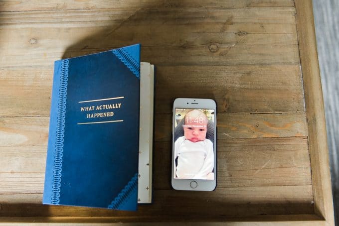 newborn photo on lock iphone screen during lifestyle newborn photography session