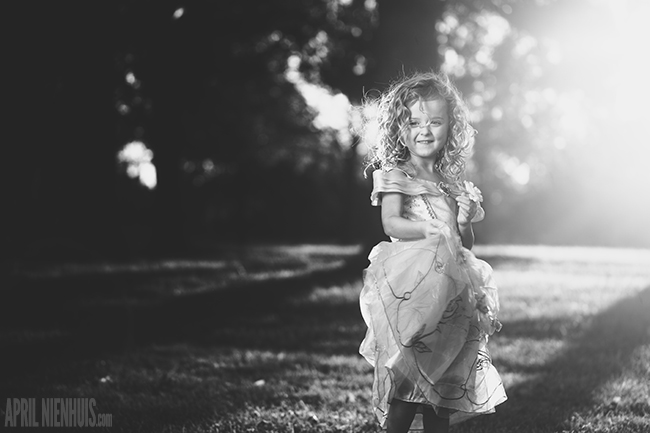 backlit-photo-of-child-dressed-like-Princess-Belle-by-April-Nienhuis