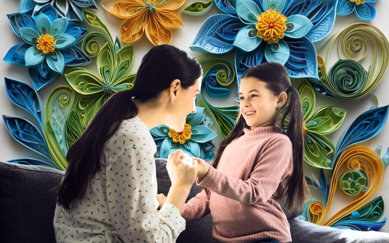 Mother tells daughter a story about an early memory of her life. Background flowers in the style of paper quilling