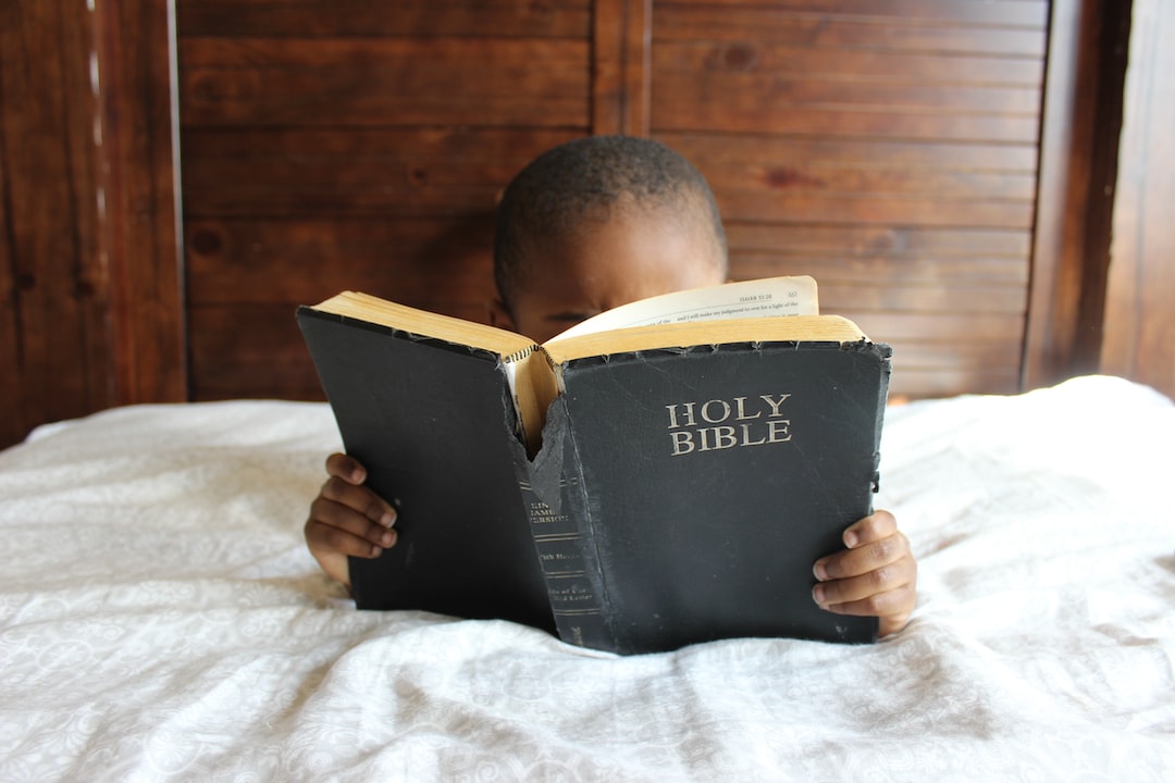 Elementary student reading the Bible