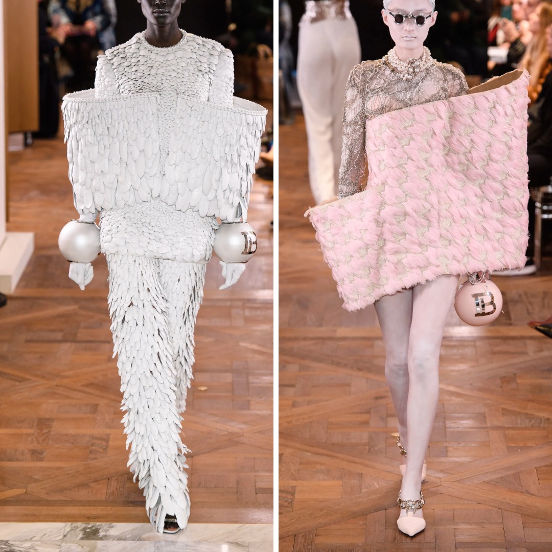 Two runway looks from Balmain Spring 2019 Haute Couture by Olivier Rousteing, showing sculptural white and pale-pink outfits made from layered feathers and textured fabrics, paired with spherical Balmain accessories.