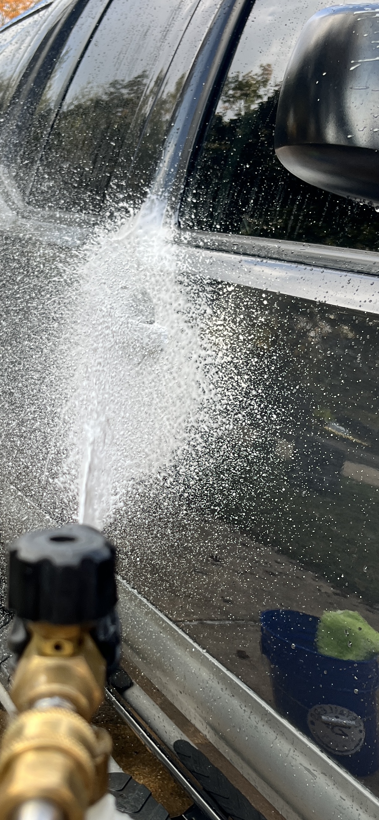 foam cannon spraying soap on to car