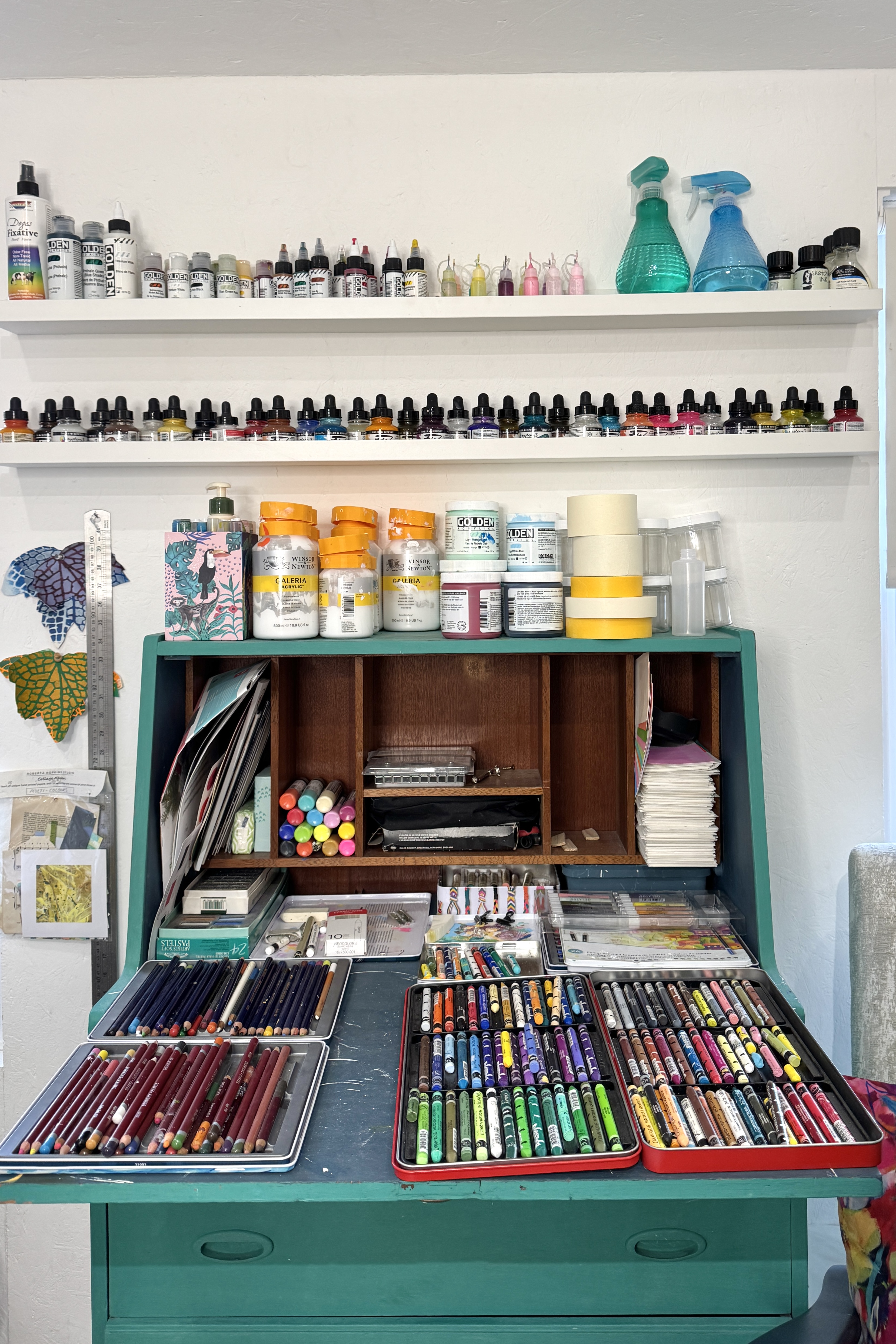 storage option in writing bureau with paint storage above