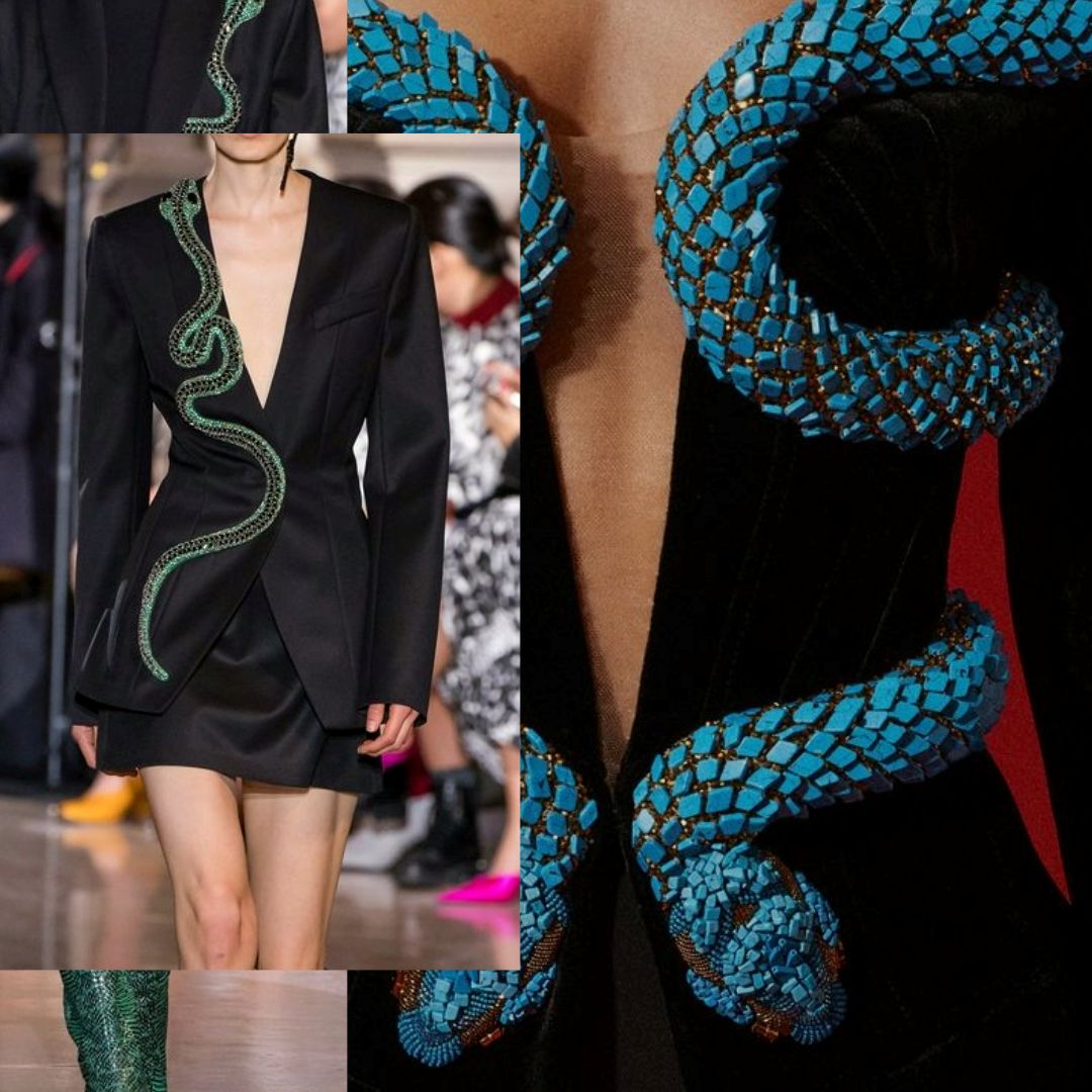 A selection of couture pieces from Balmain Resort 2023 and Andrew Gn Fall 2019 Ready-to-Wear collections, showcasing vibrant snake motifs. Highlights include a black blazer adorned with a striking green snake embroidered along the lapel and a bold turquoise beaded snake design intricately wrapping around the bodice of a black jacket