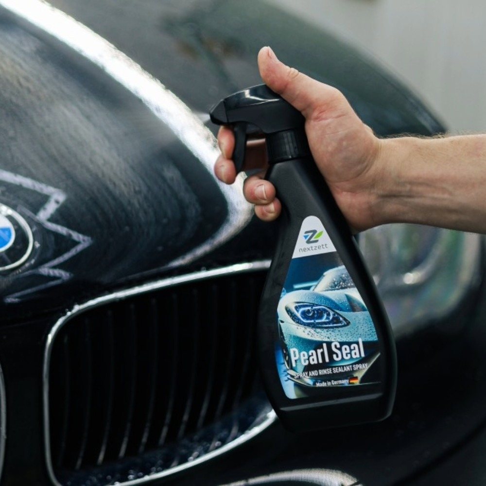 Applying nextzett Pearl Seal polymer sealant drying aid spray on Black BMW