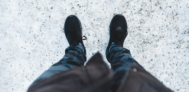 man walking in snow, seen from above