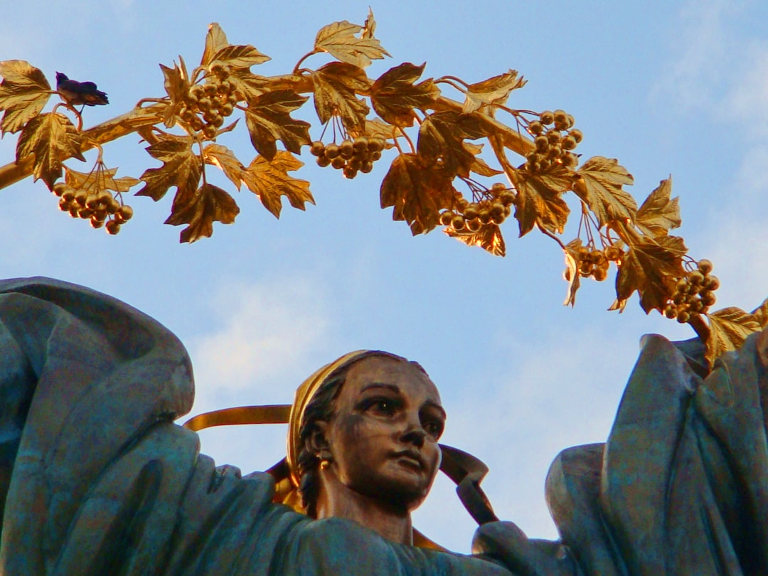 a Ukrainian girl with a golden branch on Maidan Nezalezhnosti