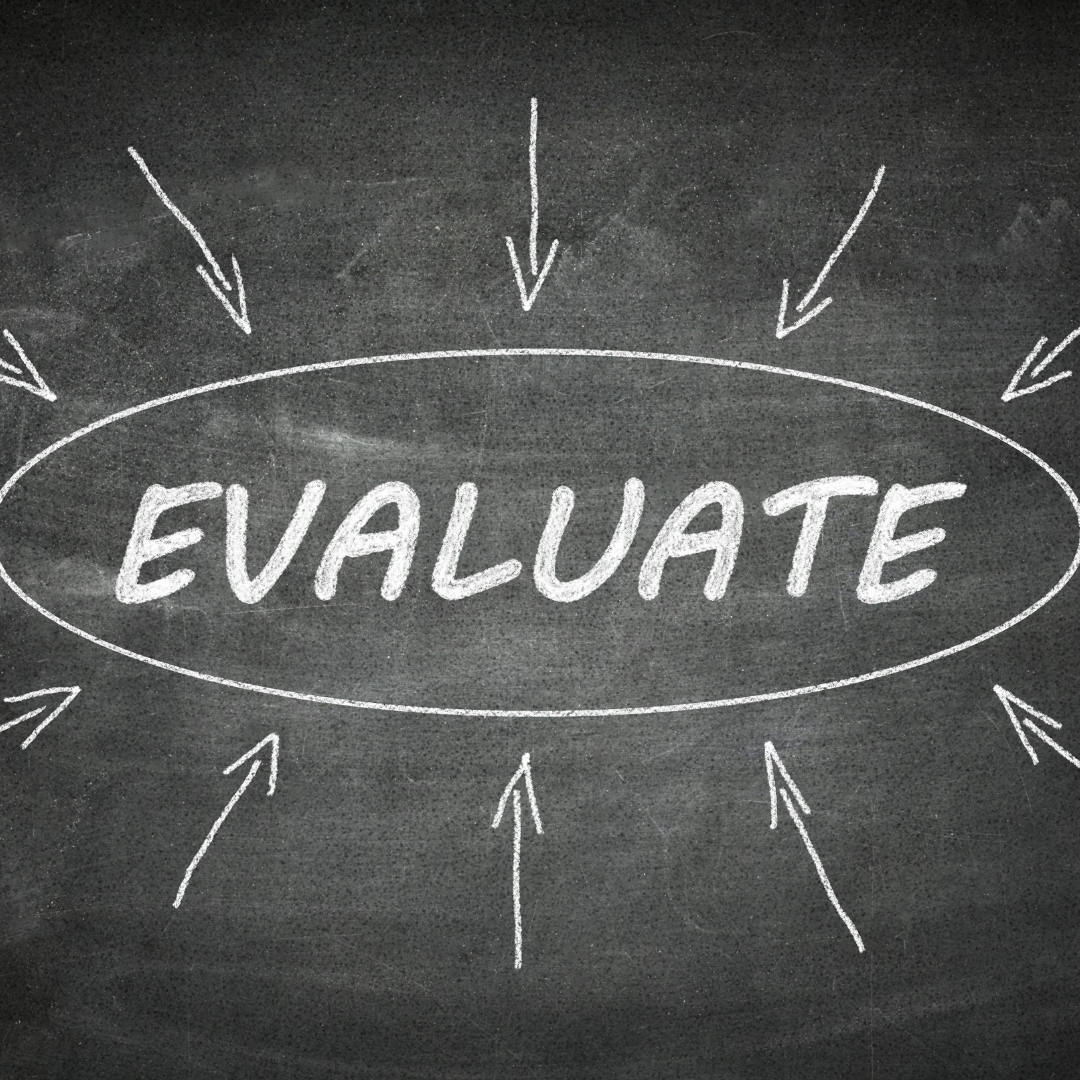Chalkboard with the word "evaluate"