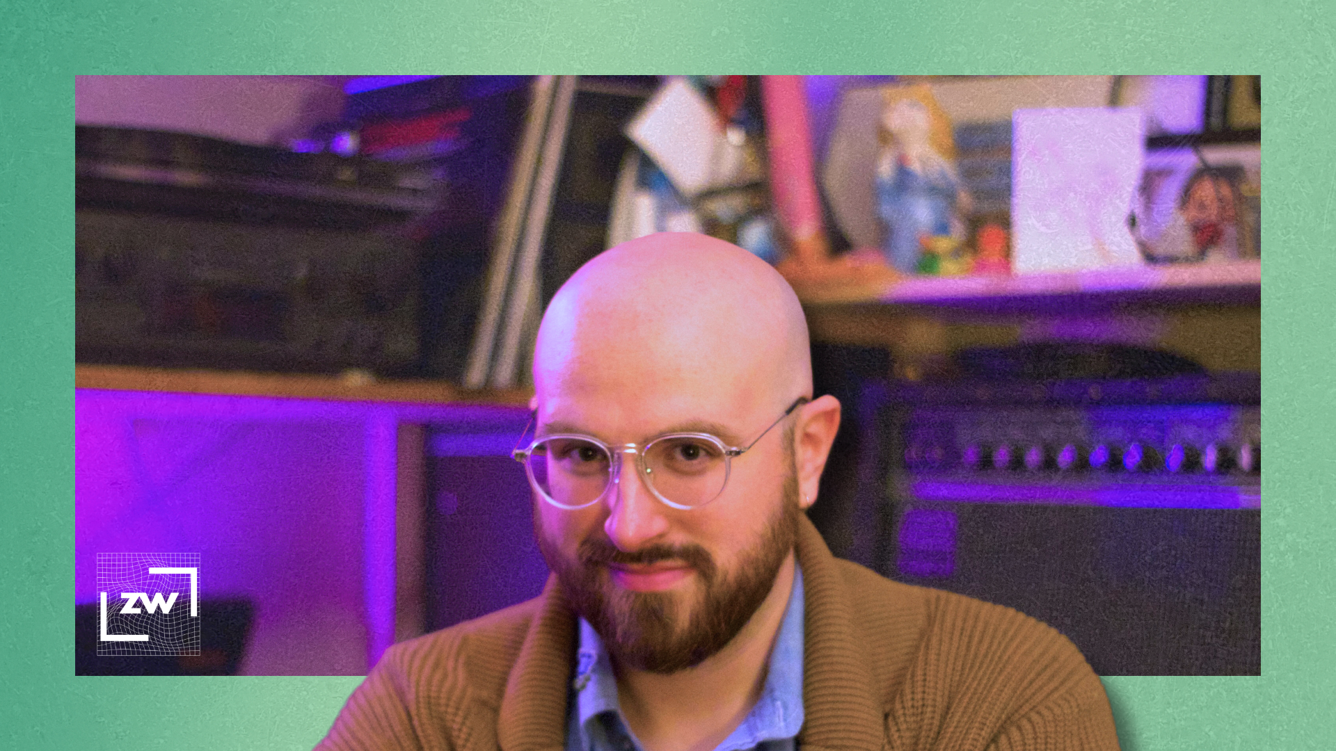 Image of me with a guitar amp in the background against a green backdrop