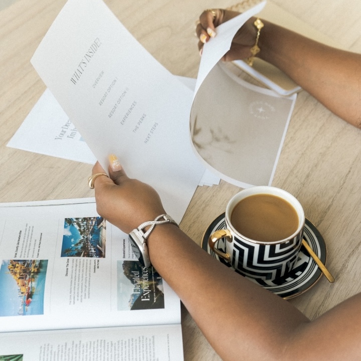 Travel curator planning with maps and notes for cultural travel