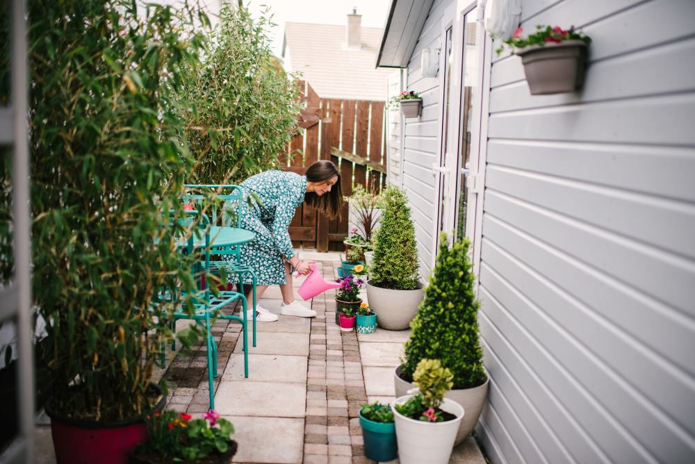 me in garden studio watering plants