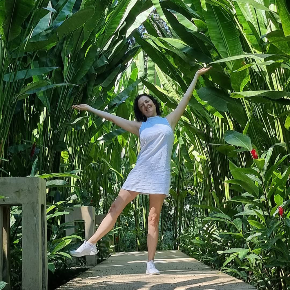 A woman lifting her arms with joy