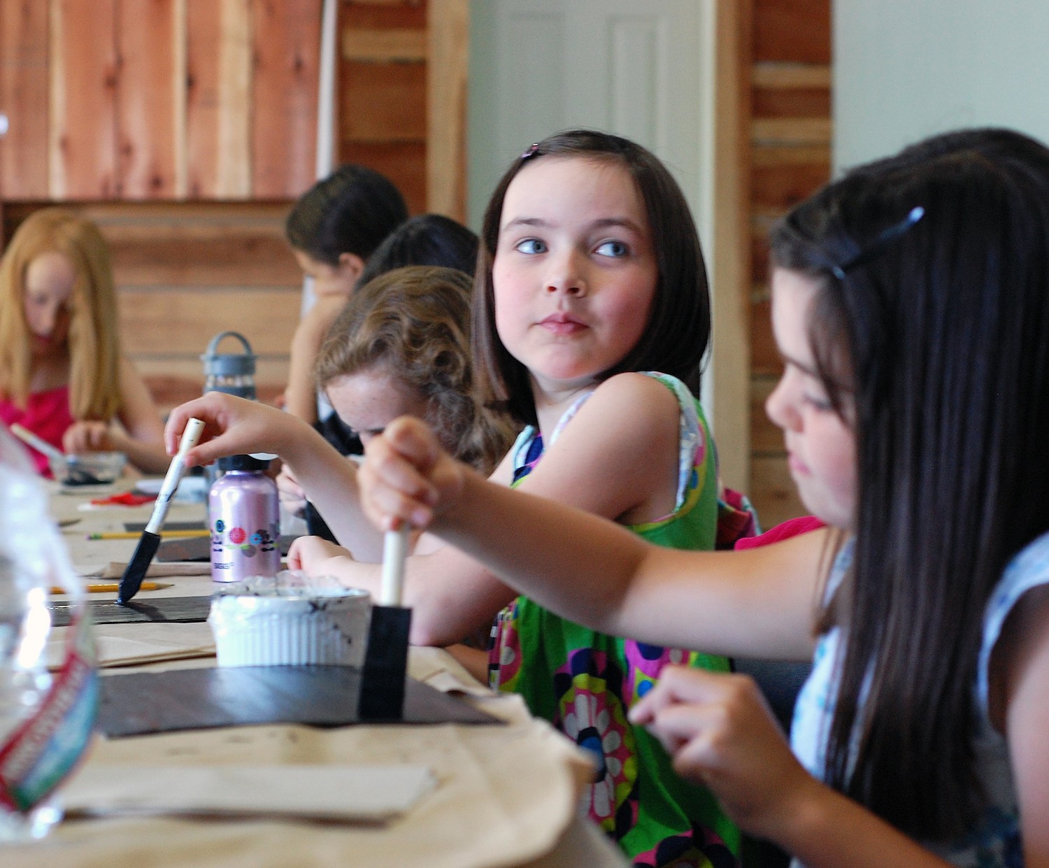Children painting a slate like Anne's in ANNE OF GREEN GABLES - a creative teaching idea from LitWits Workshops