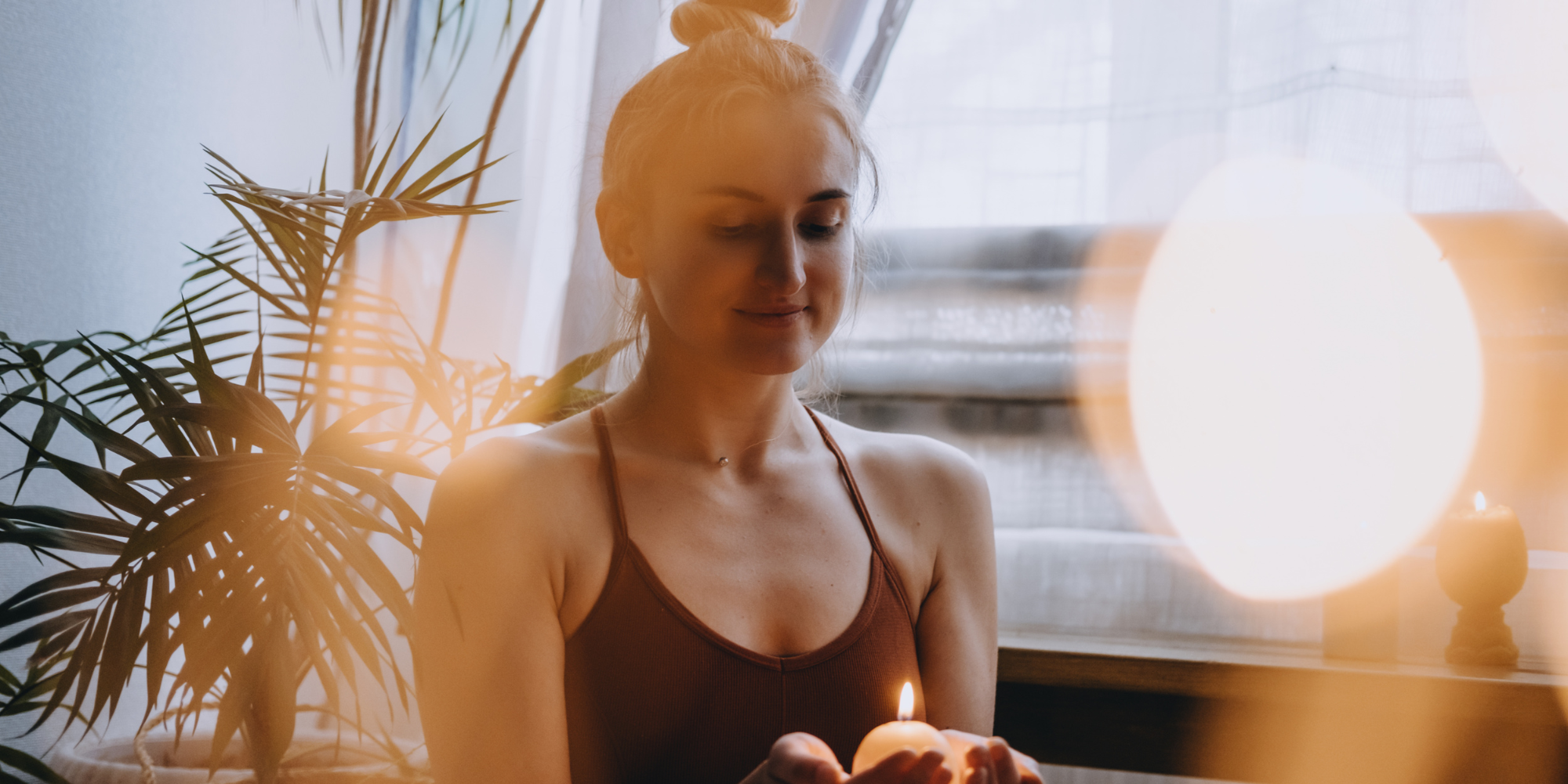 embodied woman holding candle