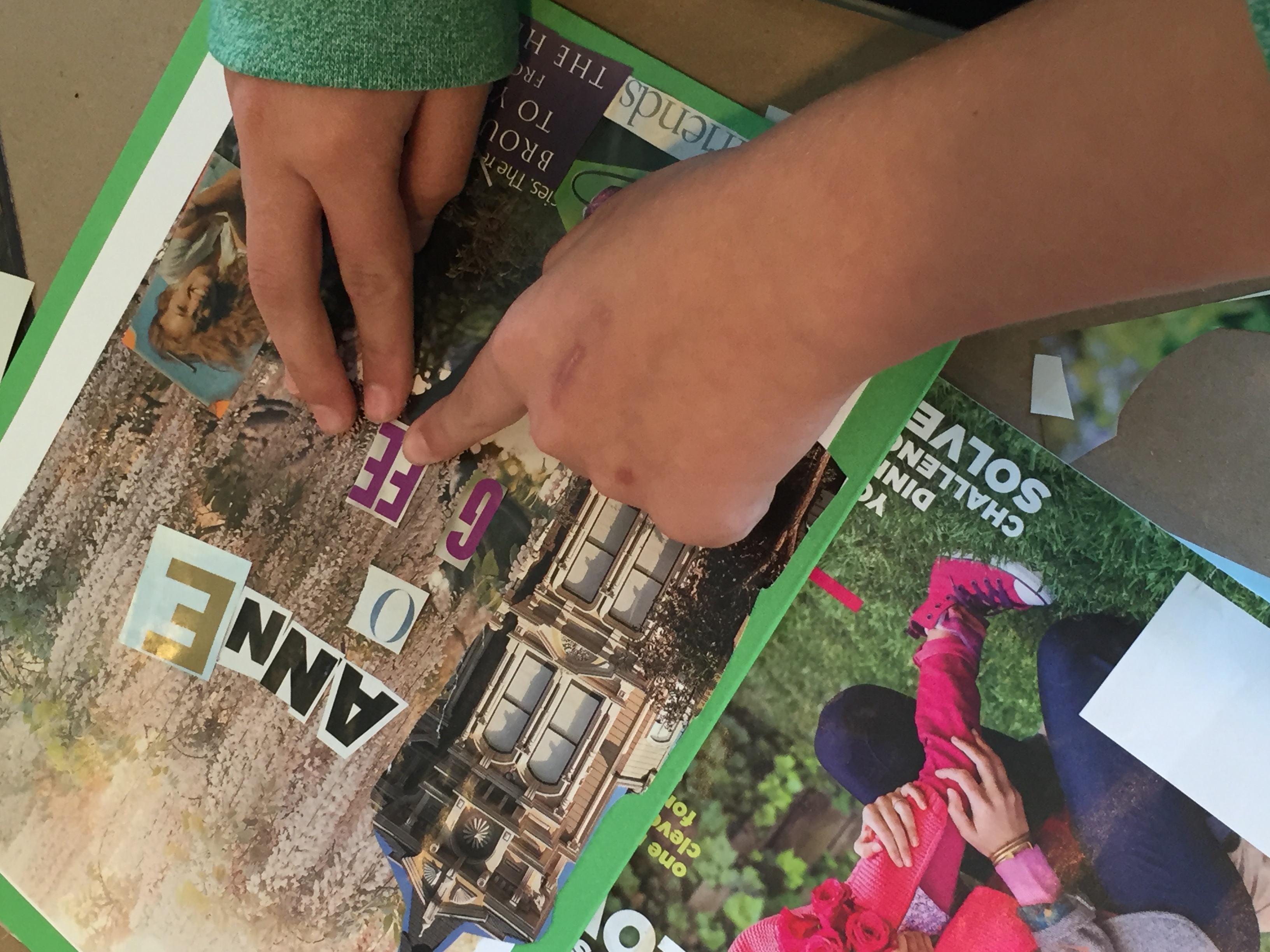 Child doing a collage project for Anne of Green Gables - a creative teaching idea from LitWits Workshops