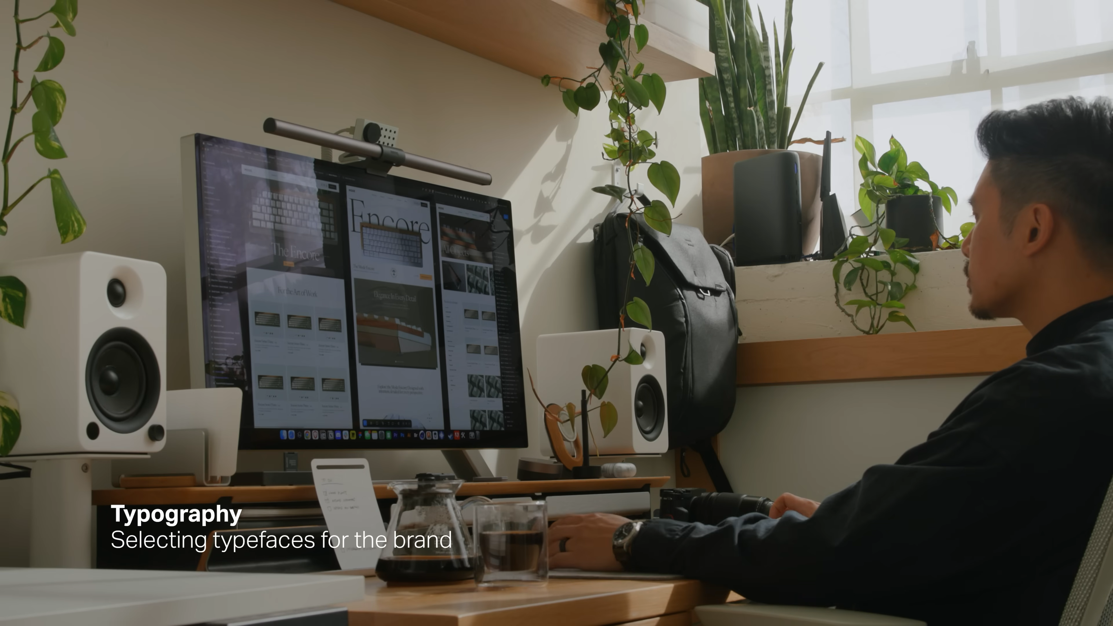 Designer working on typography selection for Mode’s rebrand, reviewing typefaces on a desktop screen, from Matthew Encina’s branding process video.