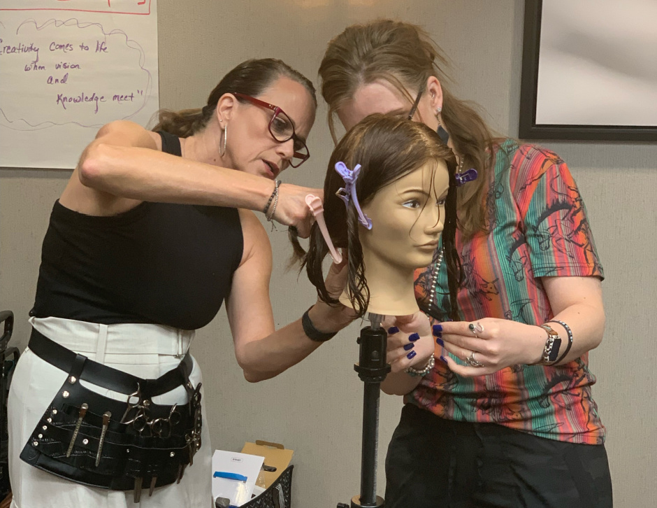 hairstylist educator teach a haircutting class