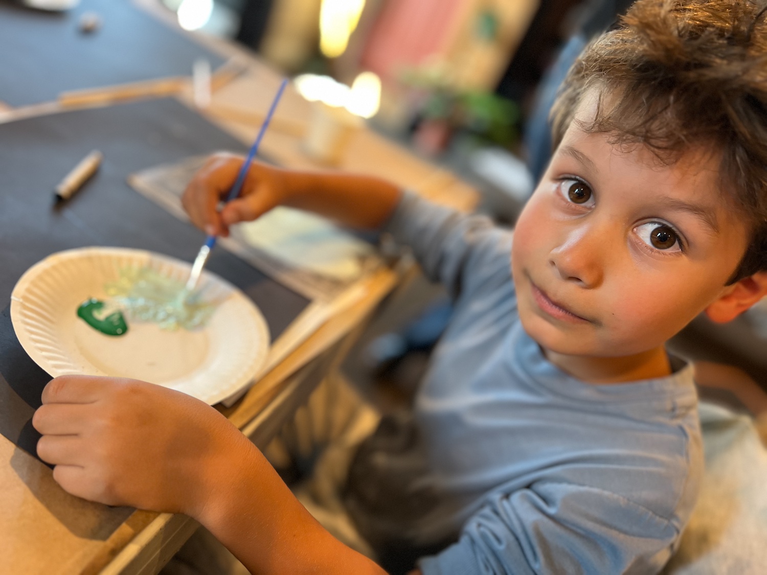 Mixing green and white paint to make celadon for a prunus vase - a creative idea for teaching A SINGLE SHARD by Linda Sue Park, from LitWits Workshops