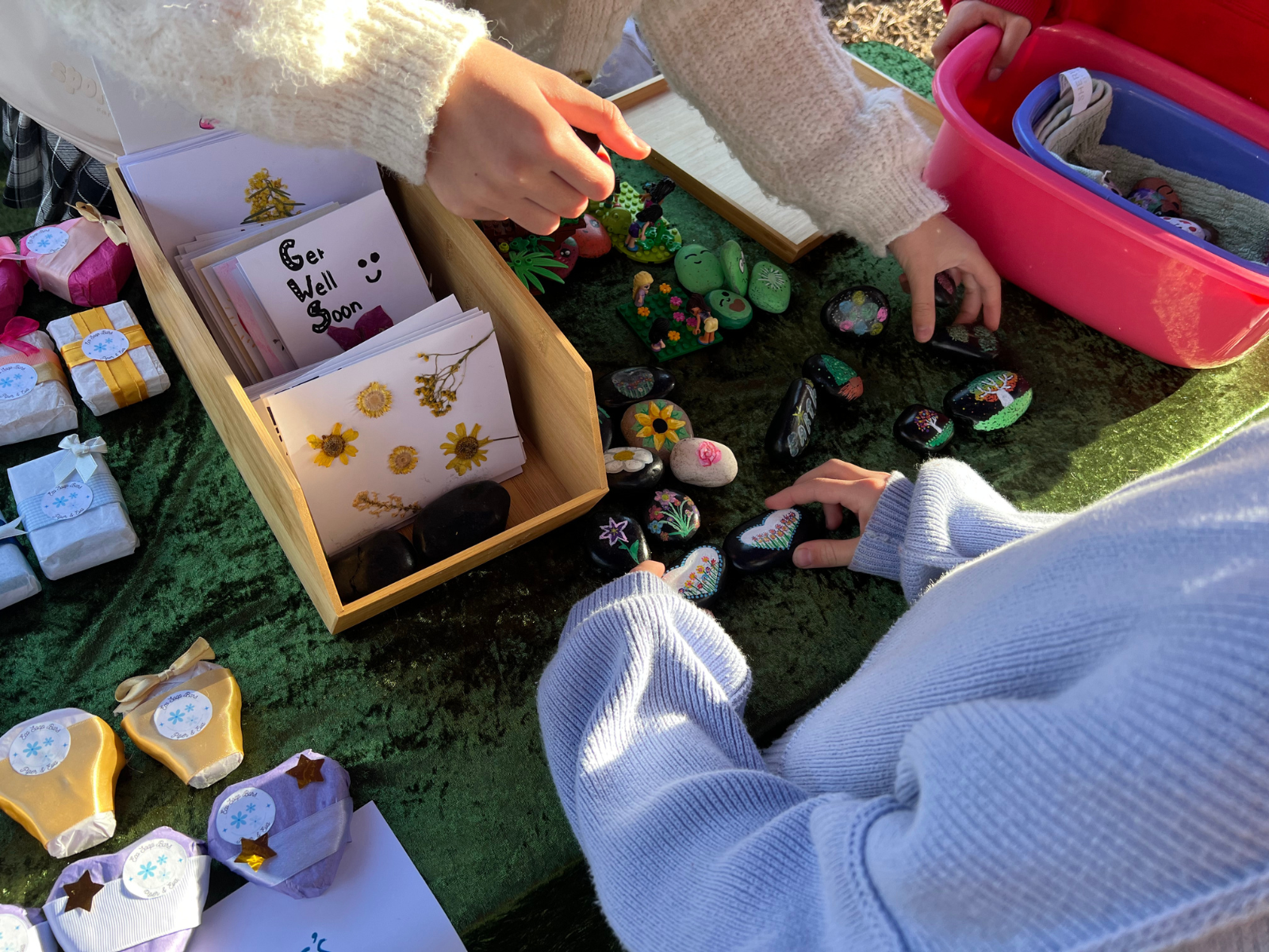 Kids setting up a market stall. 