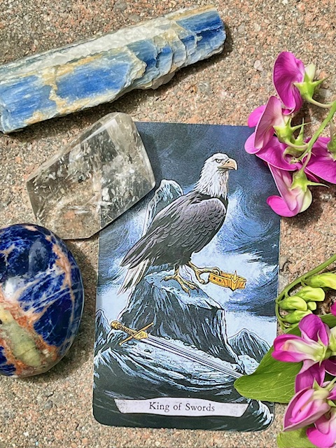 sodalite and kyanite crystals with king of swords tarot card