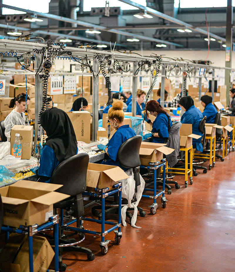 photo of factory workers on an assembly line