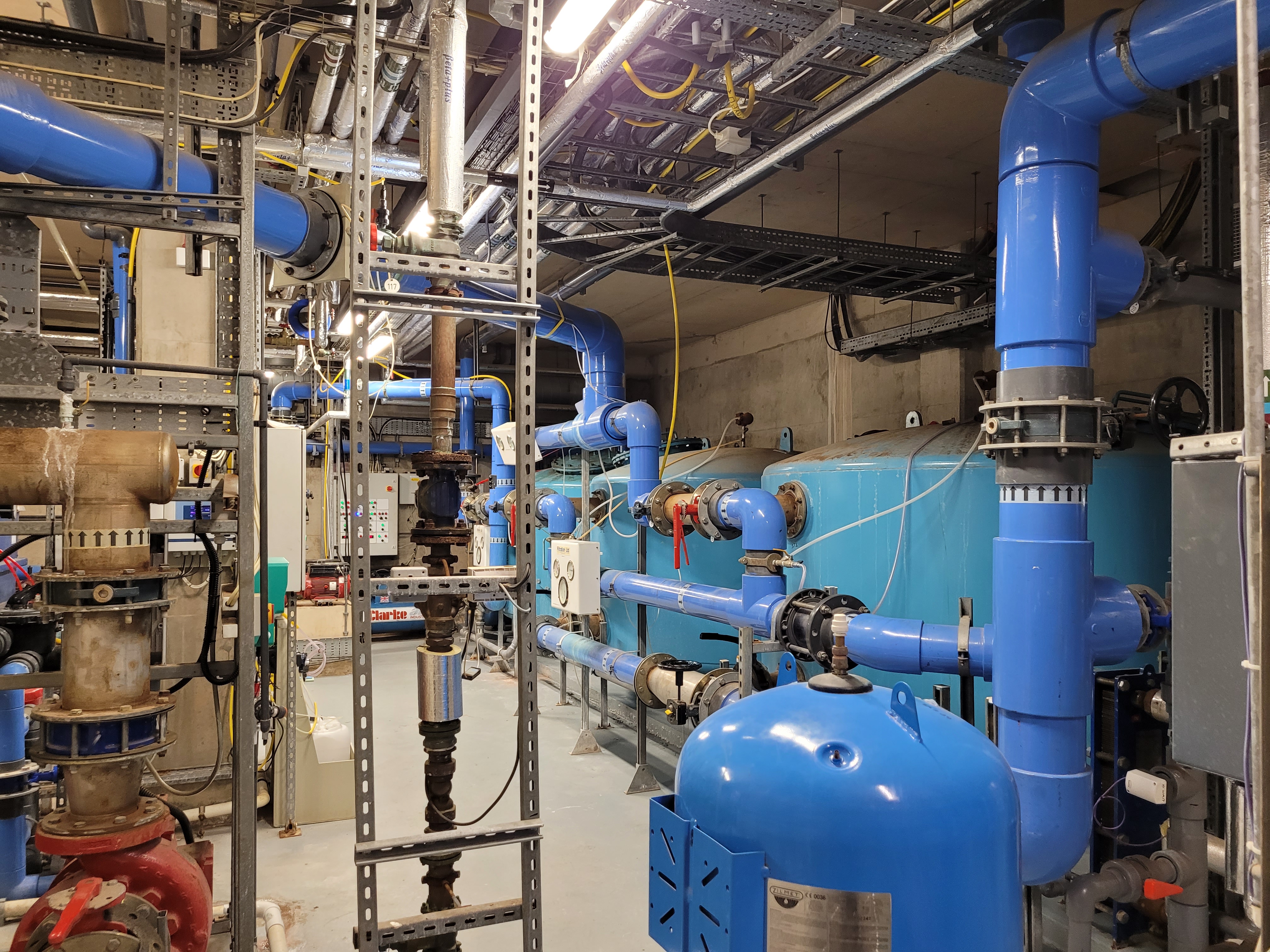 Photo of pool plant room with large steel filter vessels