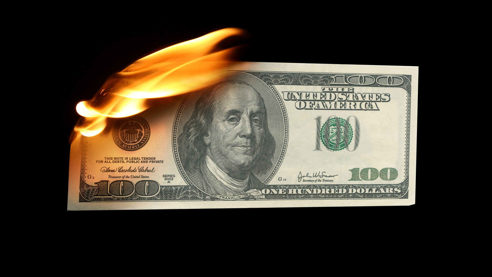 US hundred dollar bill on fire