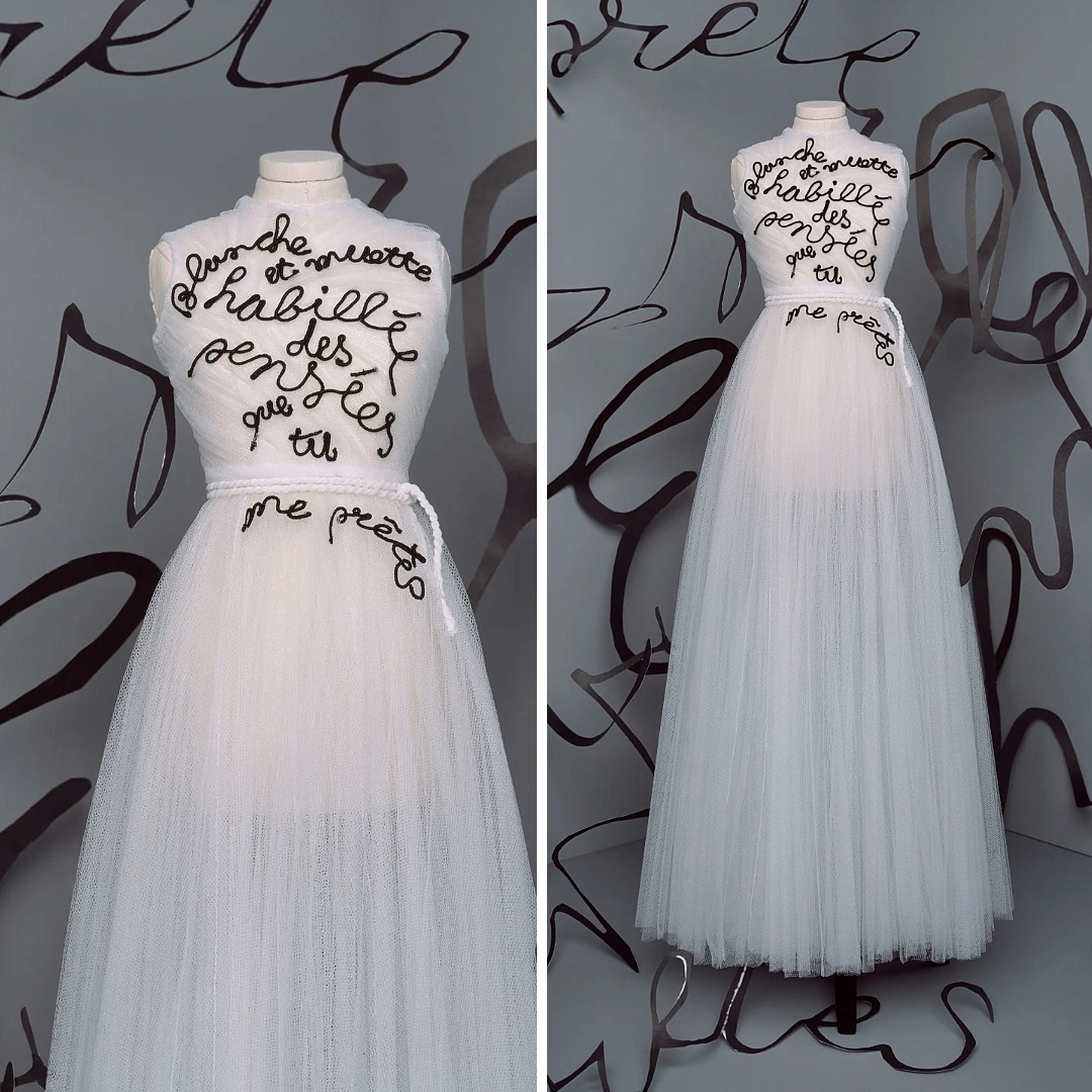 Christian Dior Fall 2020 couture “Eyre” gown featuring a black rat-tail cord quotation from Marcel Mariën embroidered on white tulle.