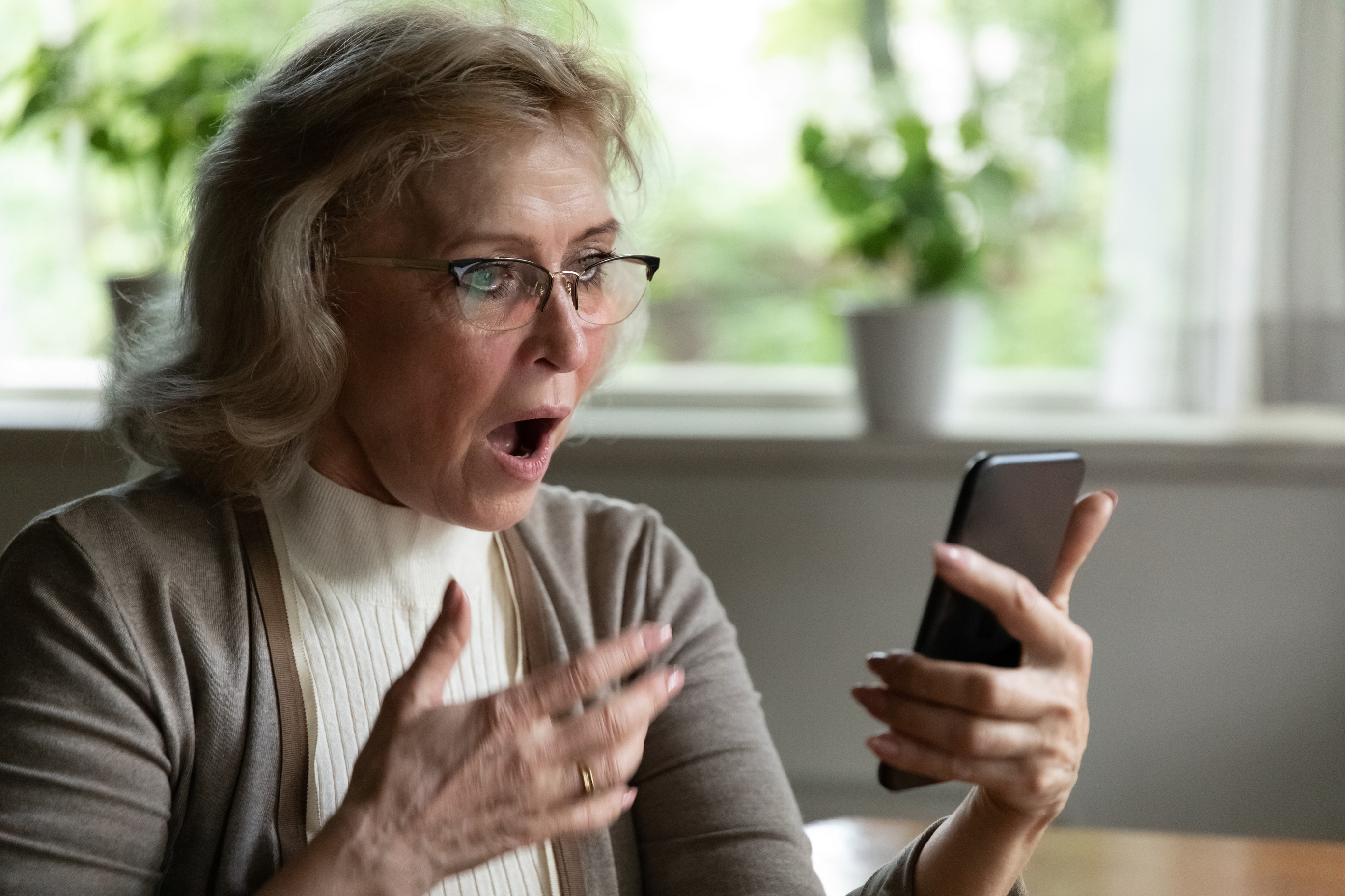 surprised woman receiving call on phone