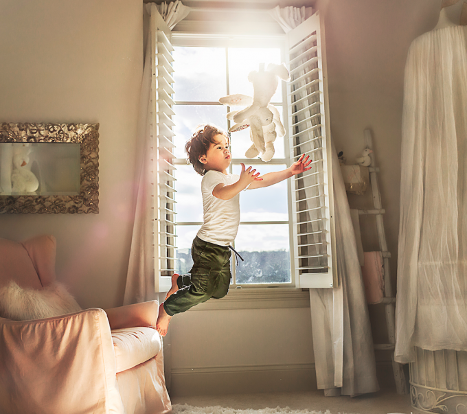 freezing motion of child jumping off chair